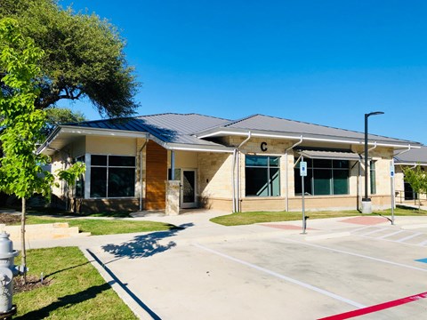 an empty parking lot in front of a building