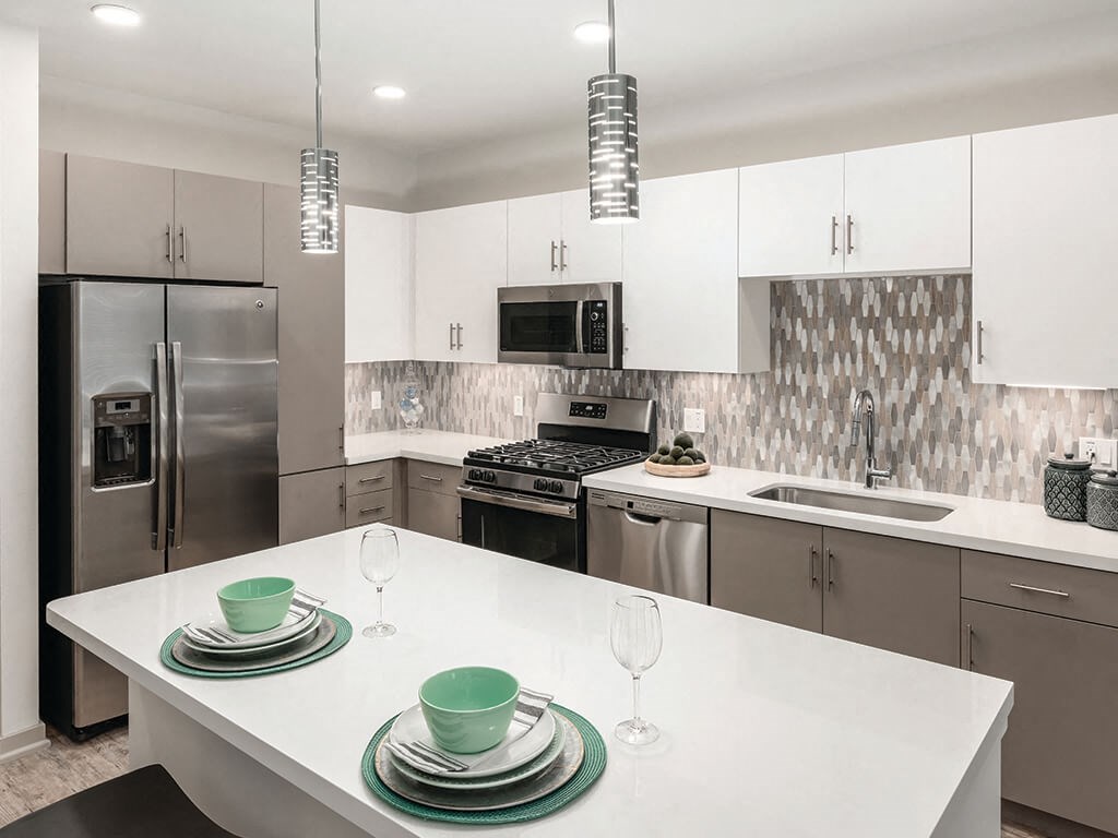 Model kitchen with white cabinets at Norte Town Lake Apartments in Tempe Arizona