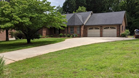 a house with a driveway and a garage door