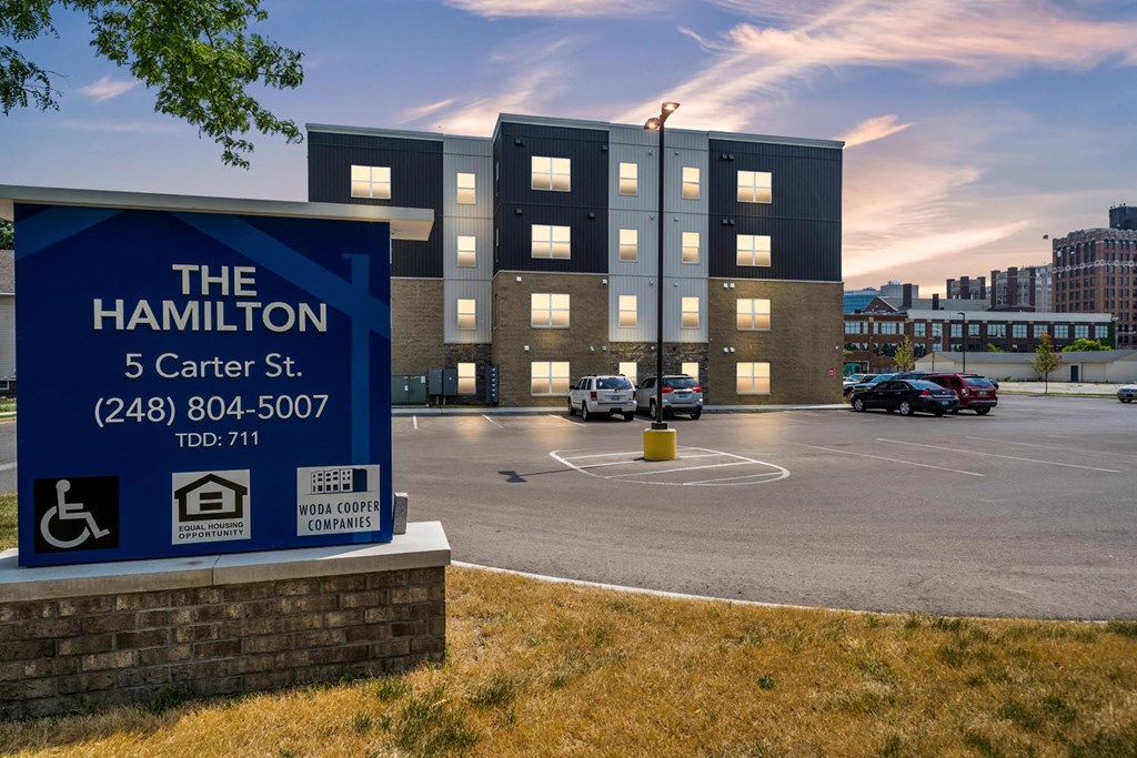 the 5 center street sign in front of a building