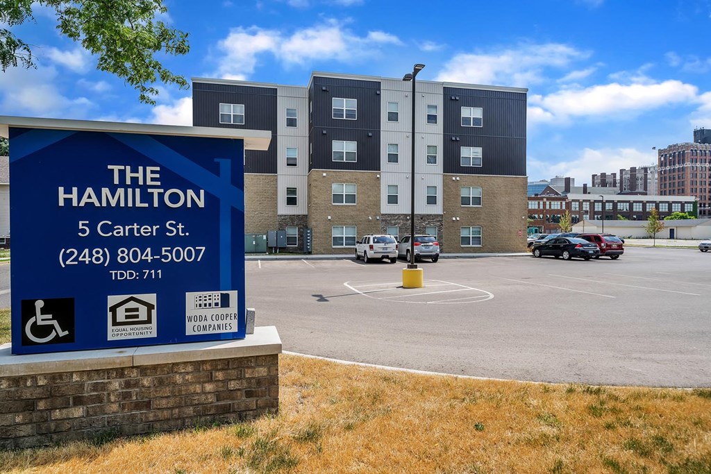 a rendering of the 5 center st building with a parking lot