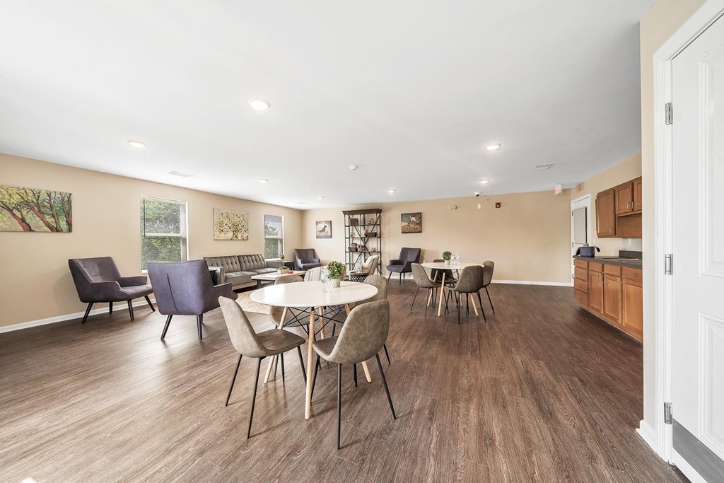 a dining room with a table and chairs