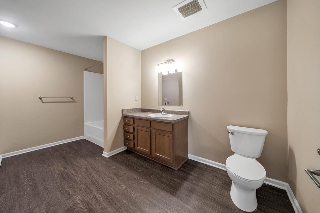 a bathroom with a toilet and a sink