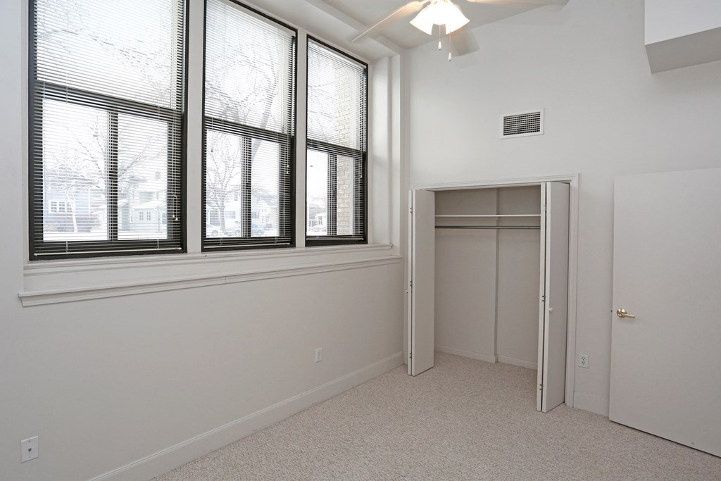 A room with a window and a door.