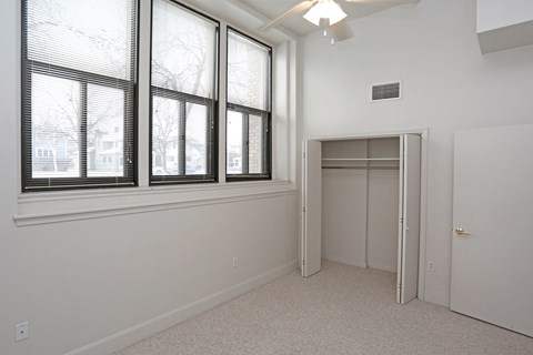 A room with a window and a door.
