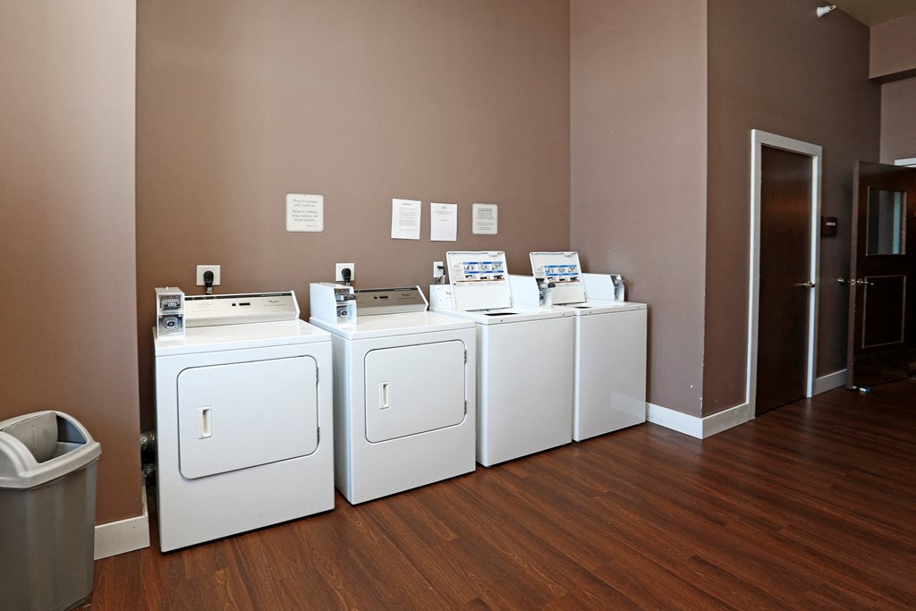 A row of washing machines in a laundromat.