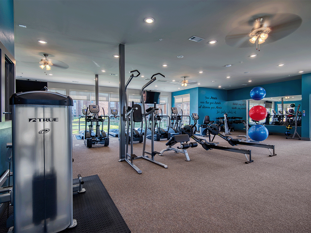 state of the art fitness center with exercise equipment apartments