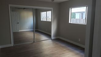 Sliding Door Closet with Mirror in Bedroom at Wilson Apartments in Glendale, CA