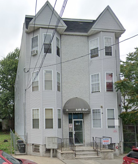 a white building with a roof on top of it