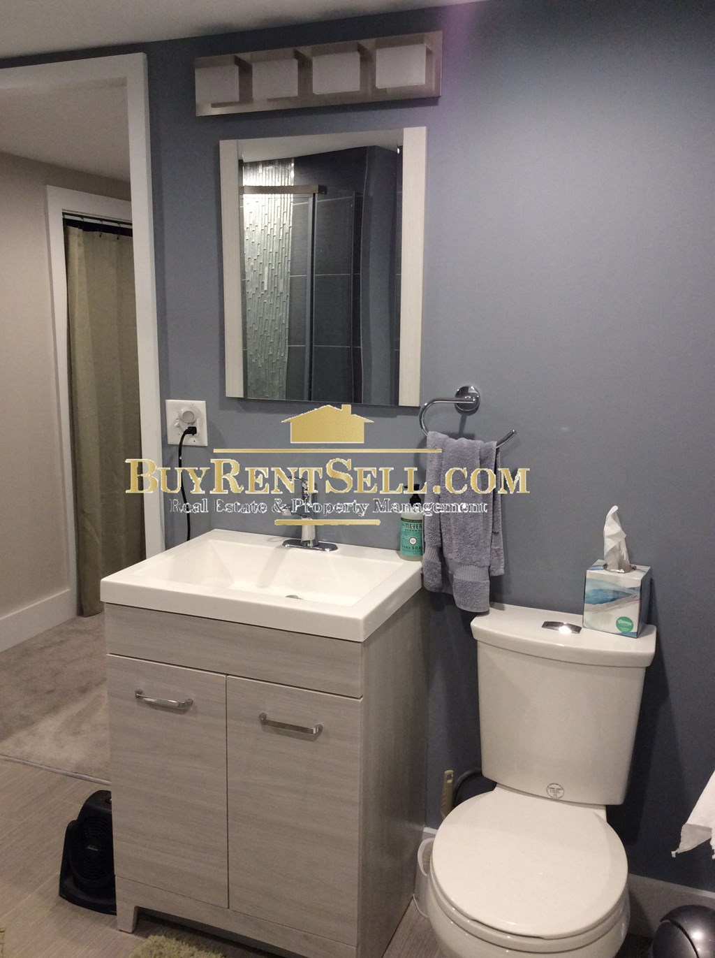 a small bathroom with a sink toilet and mirror