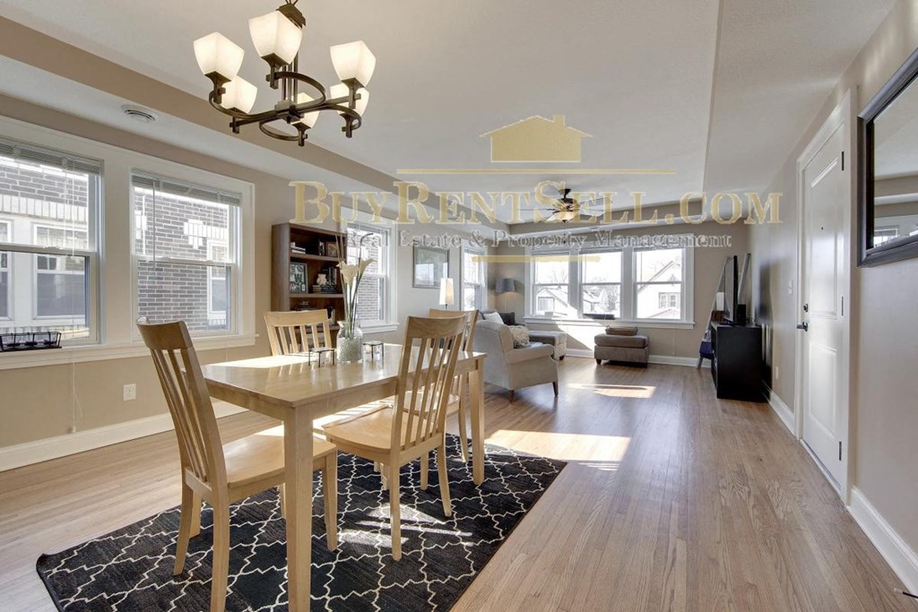 a contemporary dining room with a table and chairs