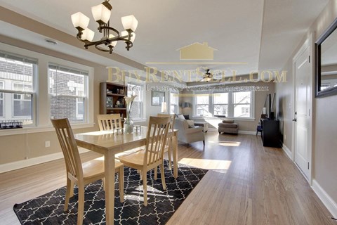 a contemporary dining room with a table and chairs