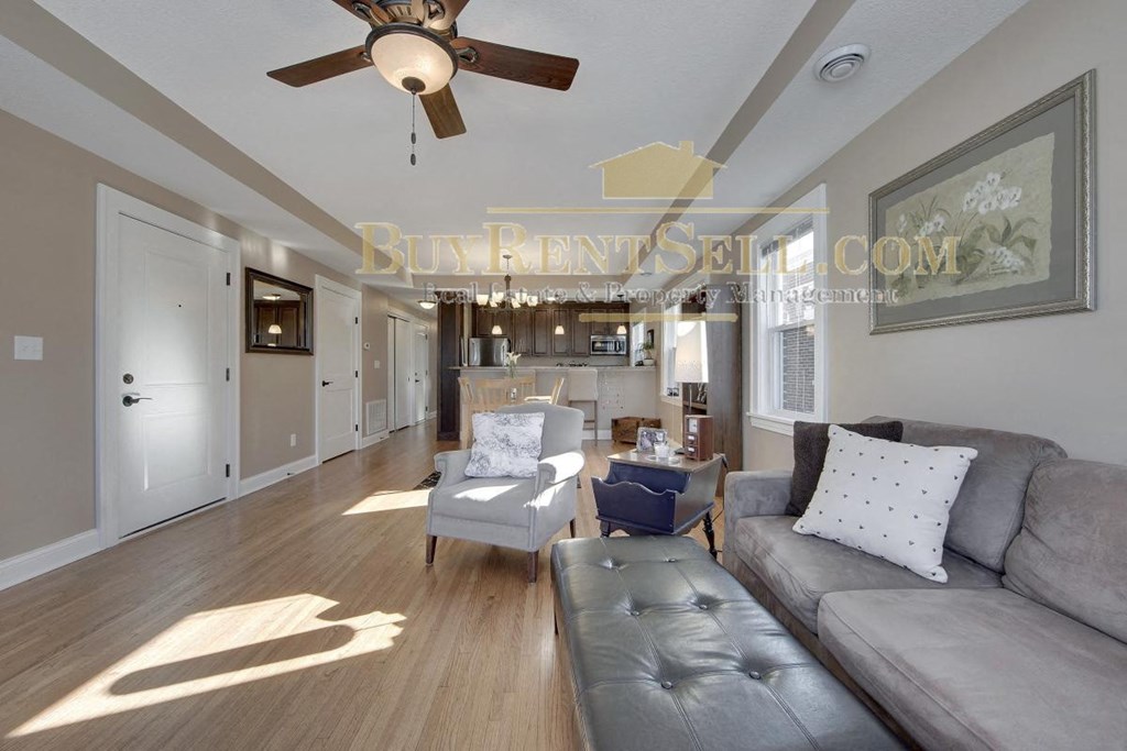 a view of the living room and kitchen from the dining room