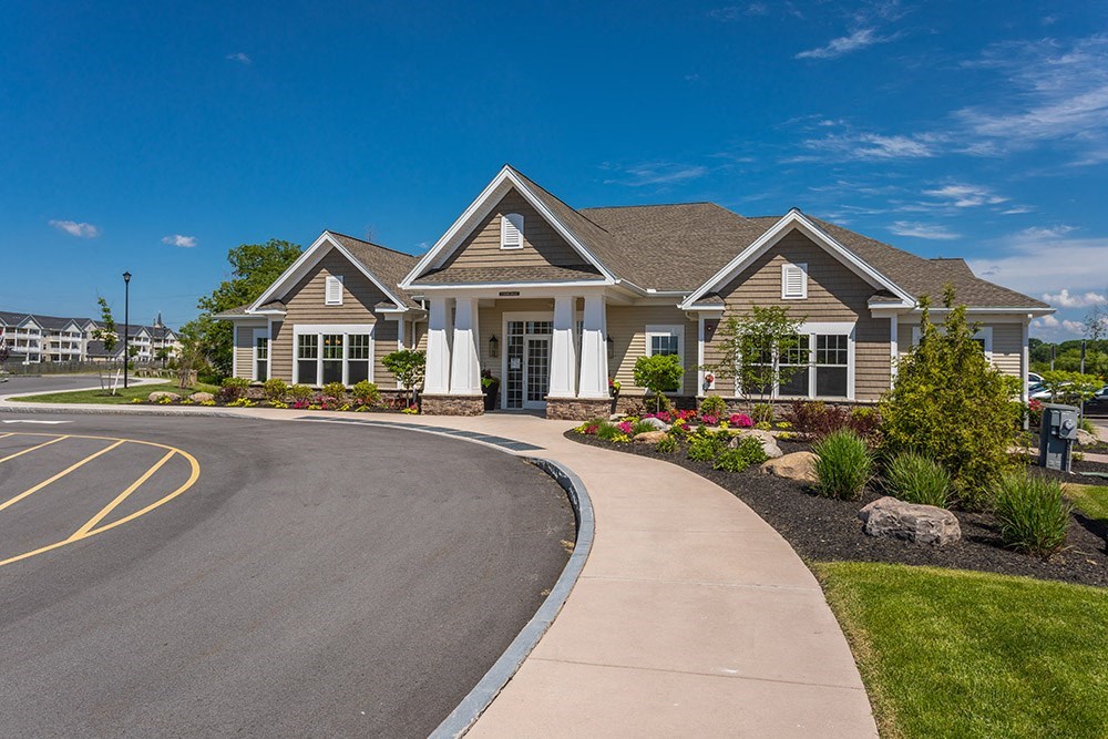 a house with a driveway and a street in front of it