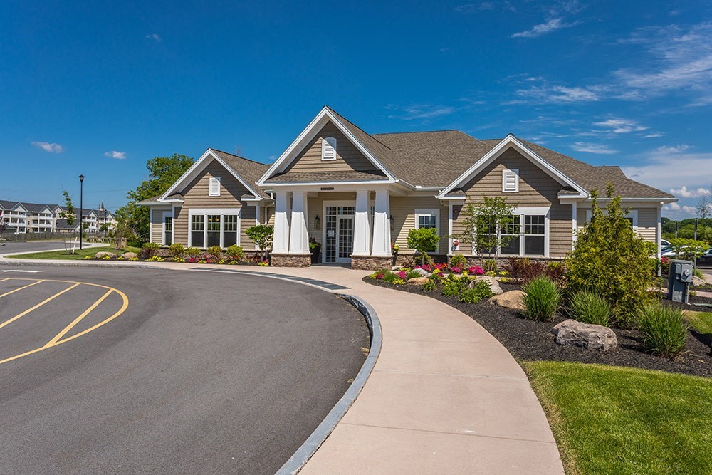 a house with a driveway and a street in front of it