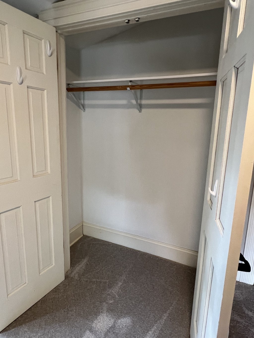 the closet in the master bedroom is empty and ready to be remodeled