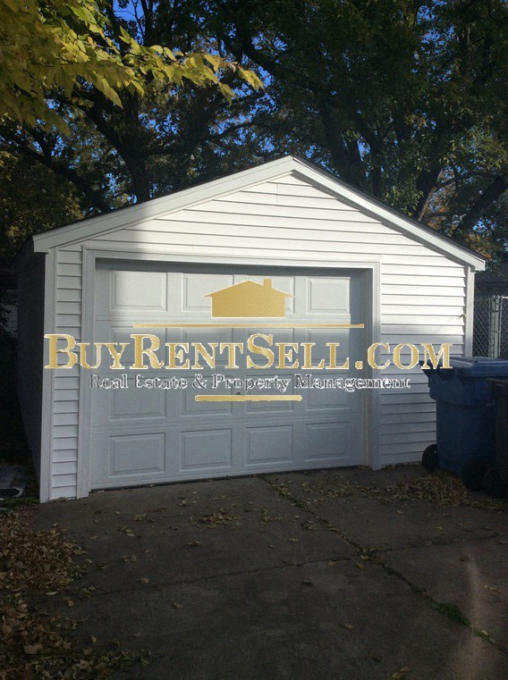 A garage with the text BuyRentSell.com on it.