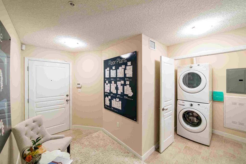 a laundry room with a washer and a dryer in it
