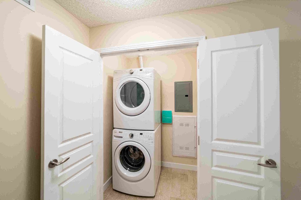 a washer and dryer in a laundry room with a door