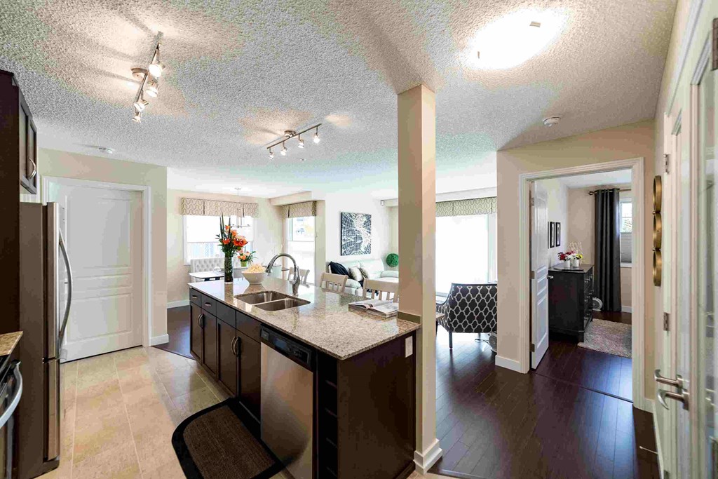 a view of a kitchen and living room in a house