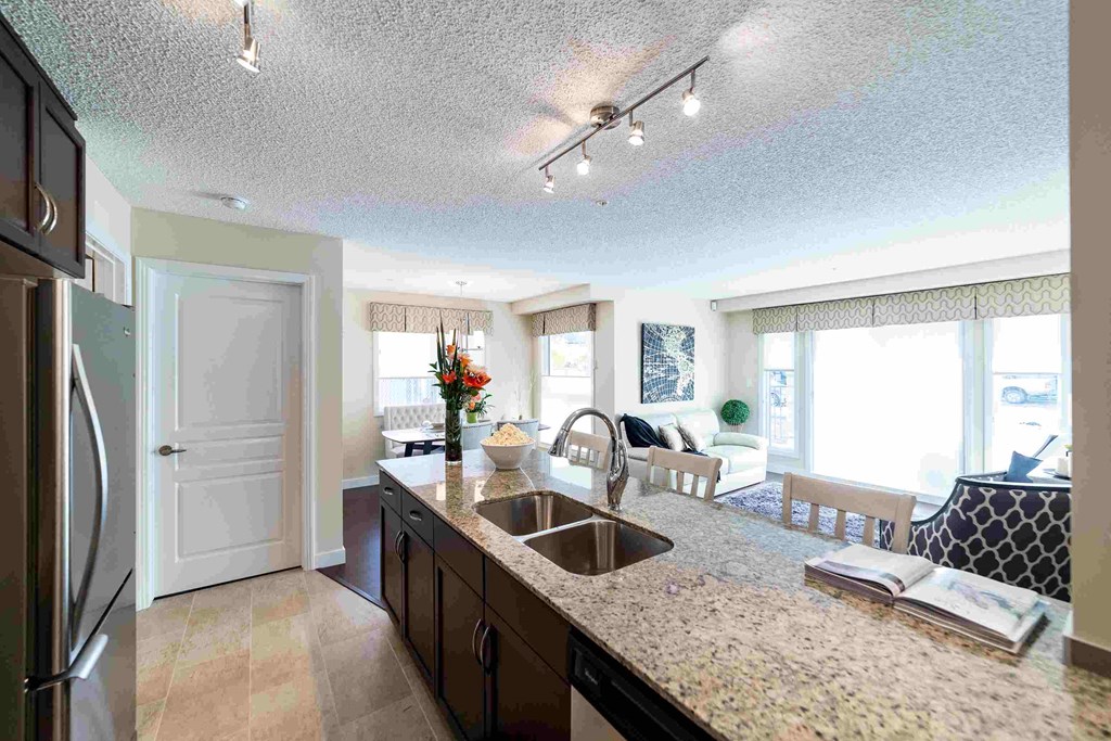 a kitchen with a sink and a counter top