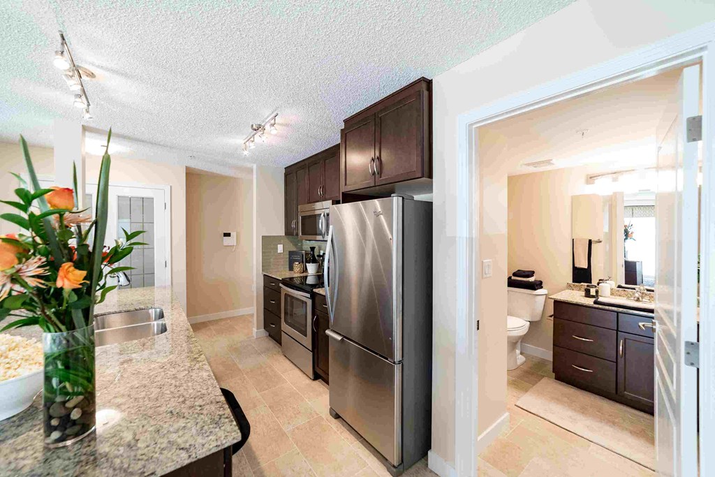 a kitchen with stainless steel appliances and a counter top
