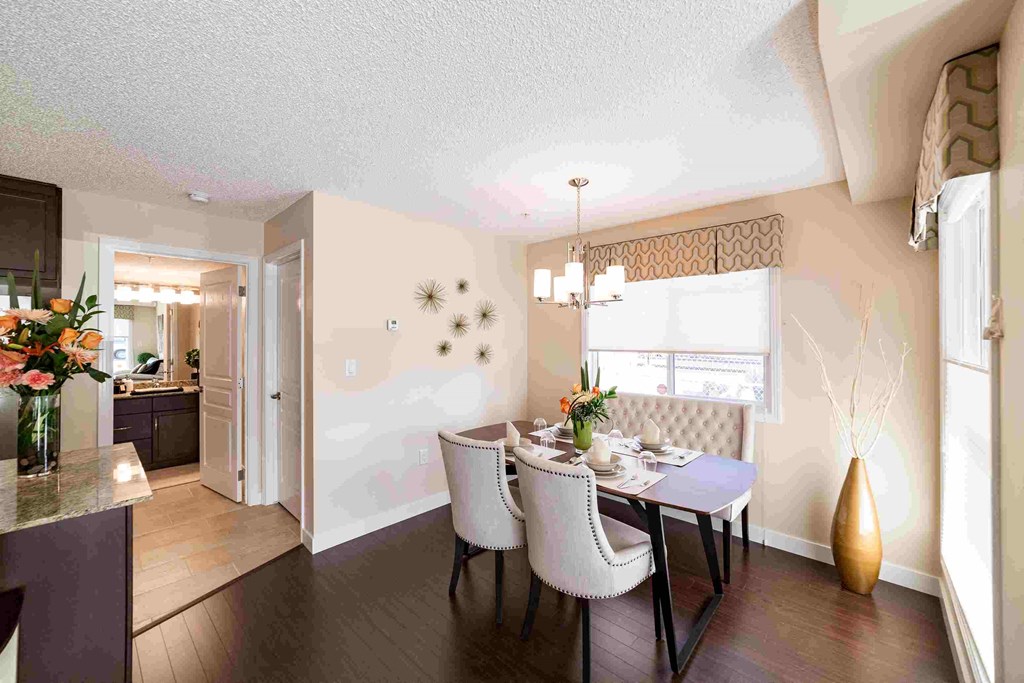a dining room with a table and chairs