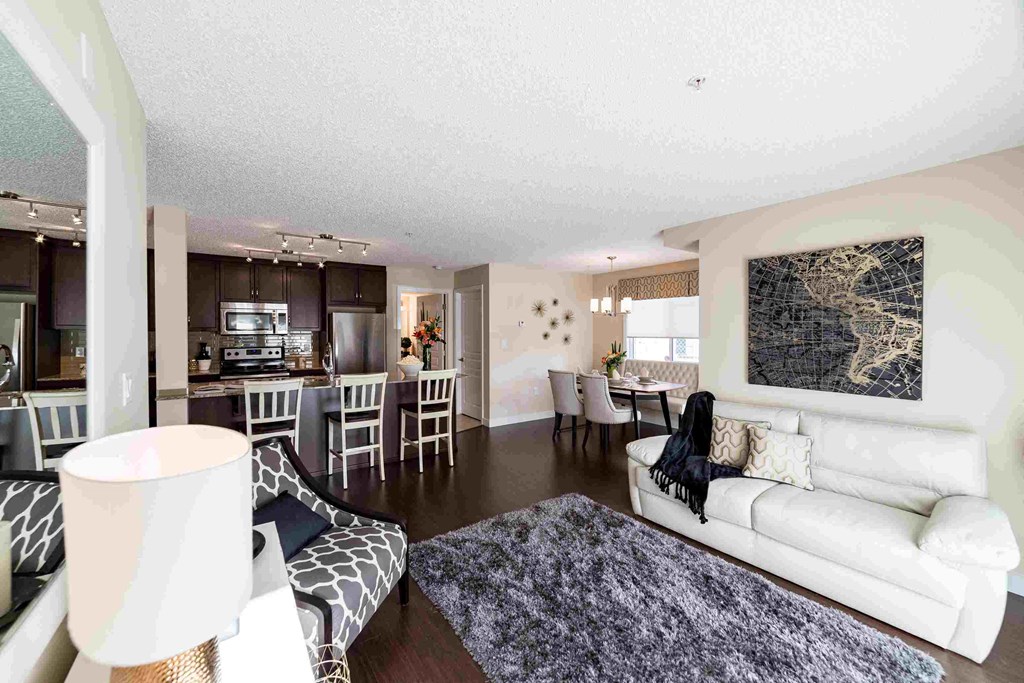 a living room and dining room with a couch and a table