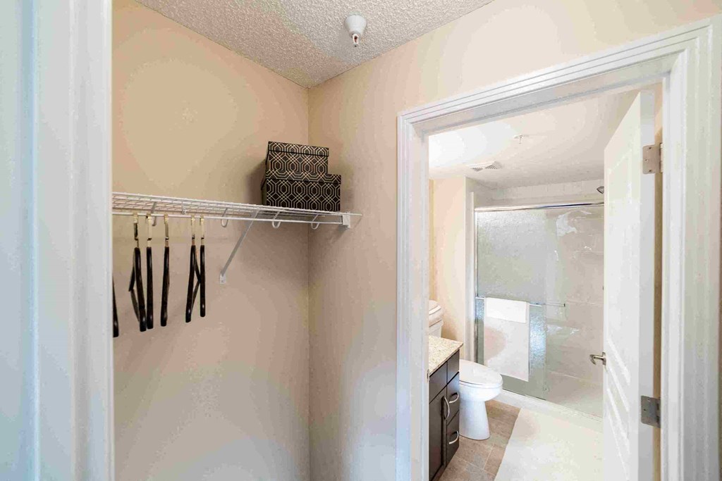 a bathroom with a shower and a sink and a mirror