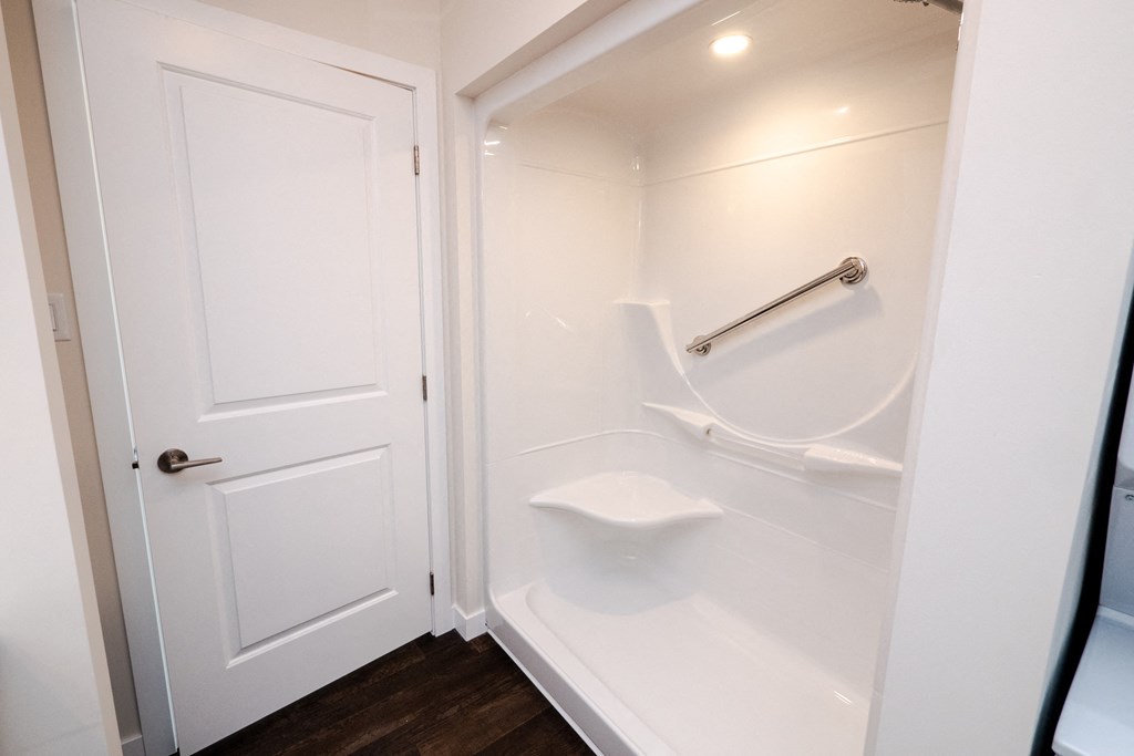 a small bathroom with a shower and a toilet