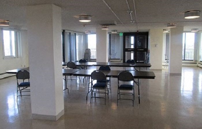 a large room with tables and chairs in it