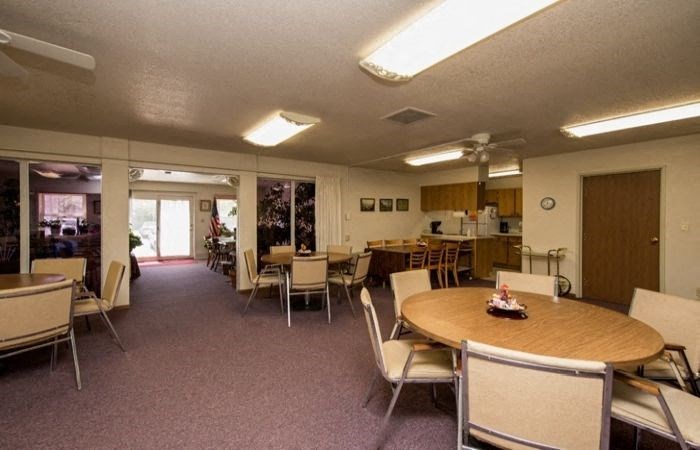 a dining room with a table and chairs