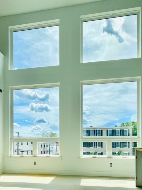 a view of the sky from a window in a room