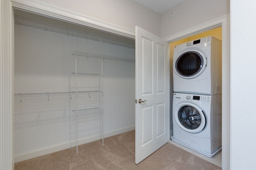 a washer and dryer in a laundry room with a door