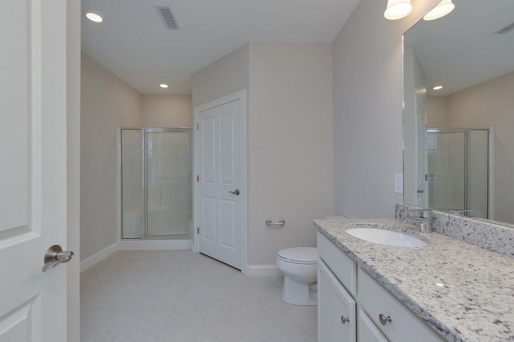 a bathroom with a sink toilet and a shower