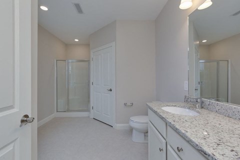 a bathroom with a sink toilet and a shower