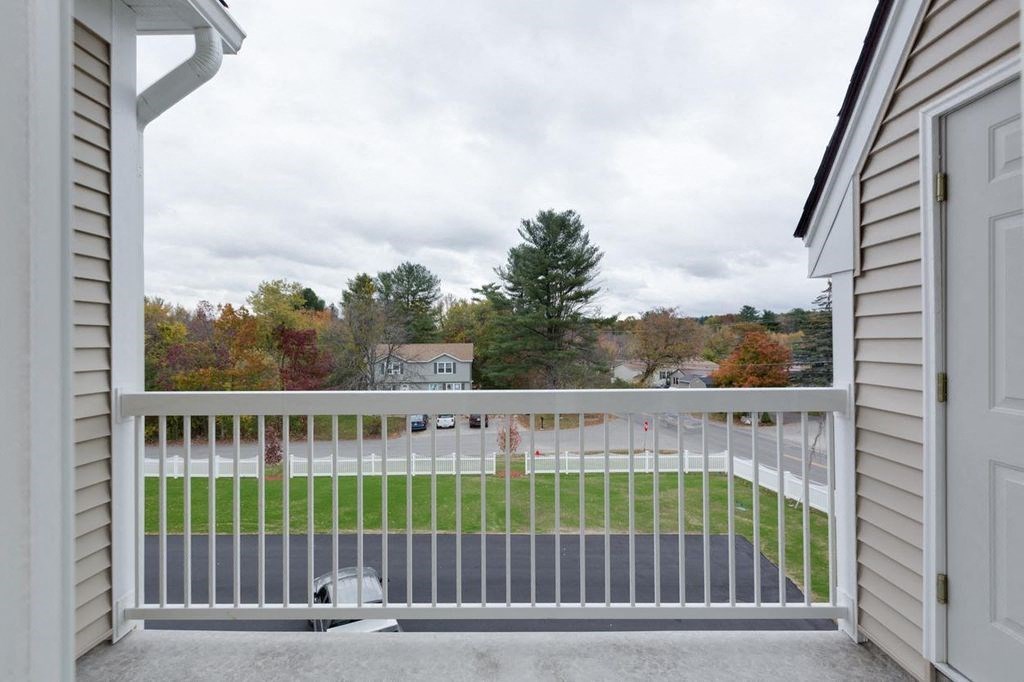 the view from the balcony of a home with a white fence