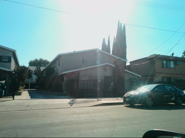 a car is parked in front of a building