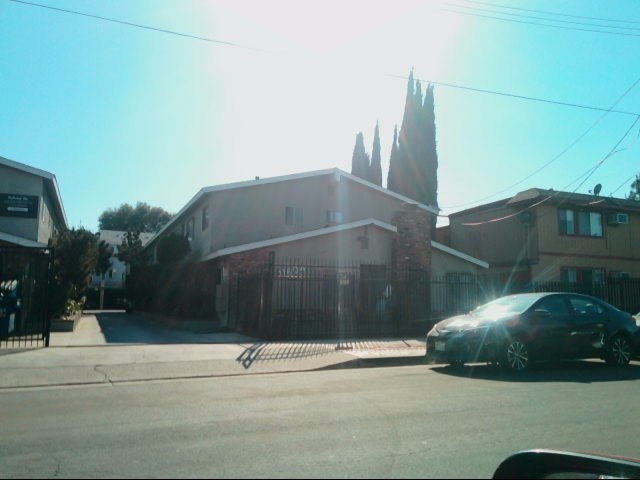 a car is parked in front of a building