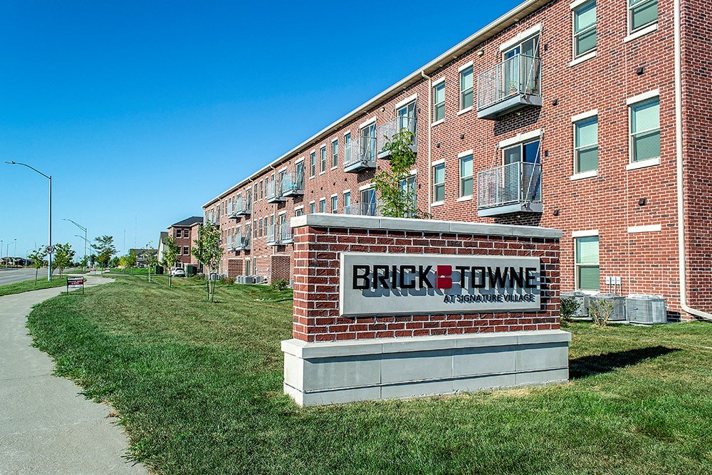 a brick building with a brick sign that reads brick towne