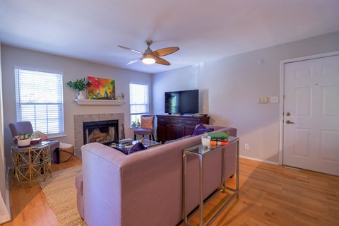 a living room with a couch and a tv