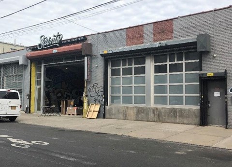 A coffee shop named Spirit Coffee Bar is located on a street corner.