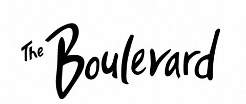 The image shows the stylized text "The Boulevard" in black ink on a white background.