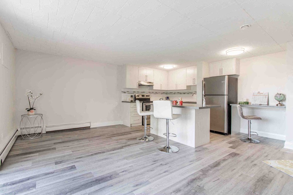 a kitchen with a counter top and a refrigerator