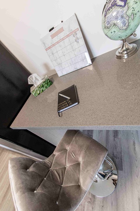 a living room with a chair and a table