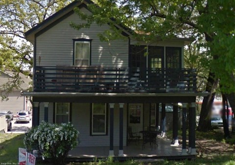 A house with a balcony is for sale.