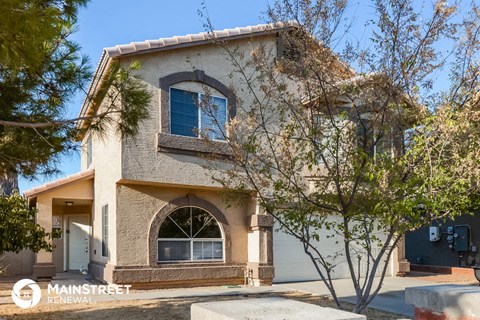 a house with a tree in front of it