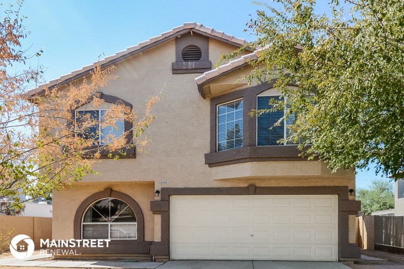 the front of a house with a garage door