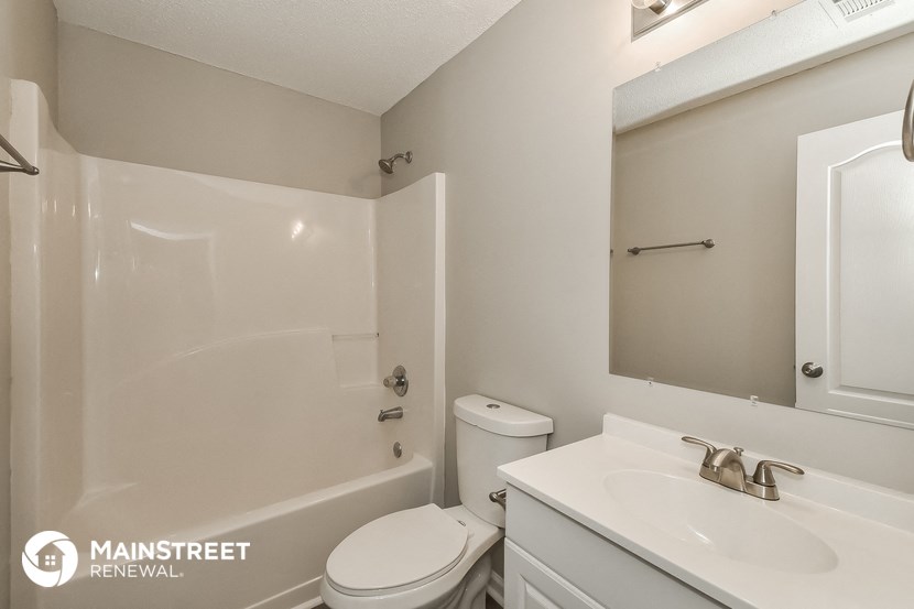 a bathroom with a sink toilet and a shower