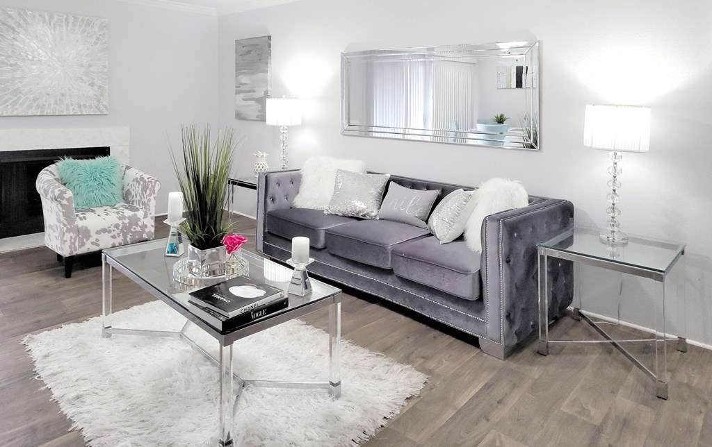 a living room with a gray couch and a coffee table